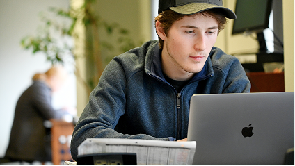 A student using his laptop